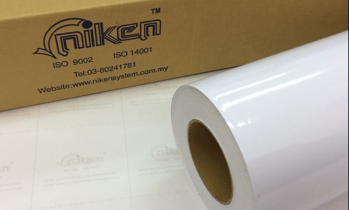 White Niken Sticker roll on branded release liner with Niken carton